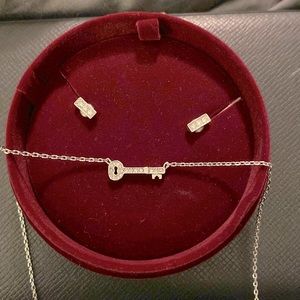 Fossil brand. Key necklace and rectangle earrings with white jewels.